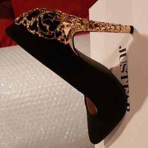 Black Suede pumps with decorative gold heel.